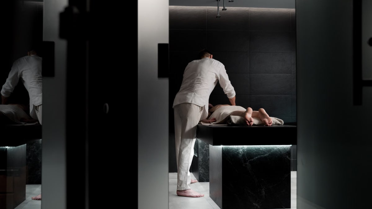 A relaxing massage in a modern spa room promoting wellness and self-care.